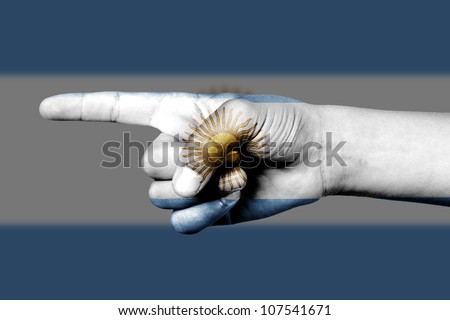 human hand point with finger in Argentina national flag