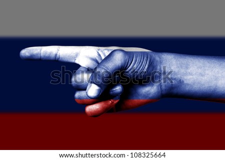Human hand point with finger in Russia national flag