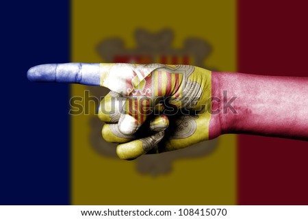 human hand point with finger in andorra national flag