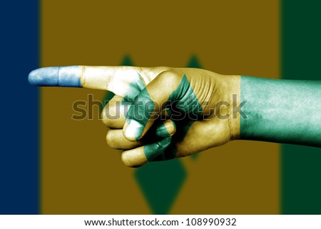 Human hand point with finger in Saint Vincent and Grenadines national flag