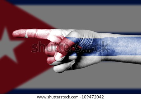 Human hand point with finger in Cuba national flag