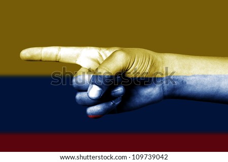 Human hand point with finger in Colombia national flag