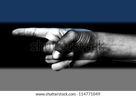 Human hand point with finger in Estonia national flag
