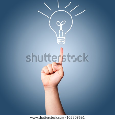 Hand pointing to the hand draw light bulb. Concept for new idea
