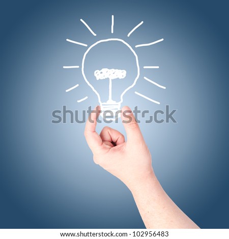 Hand holding on hand draw light bulb. Concept for new idea