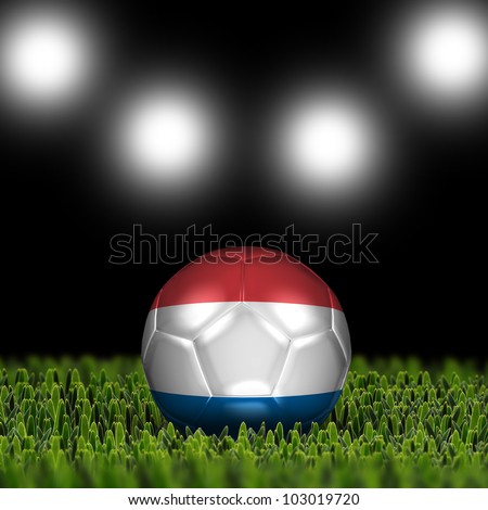 Soccer ball on grass against black and spotlight background. Country Netherlands