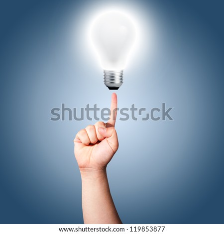 Finger pointing to light bulb that is turn on