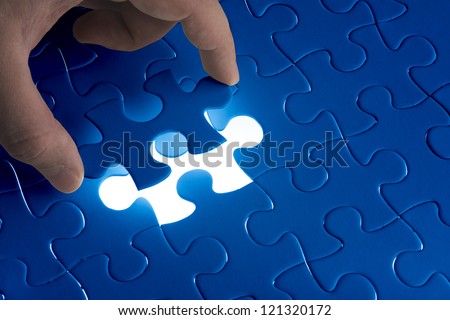Missing Jigsaw Puzzle Piece With Light Glow, Business Concept For Completing The Final Puzzle Piece