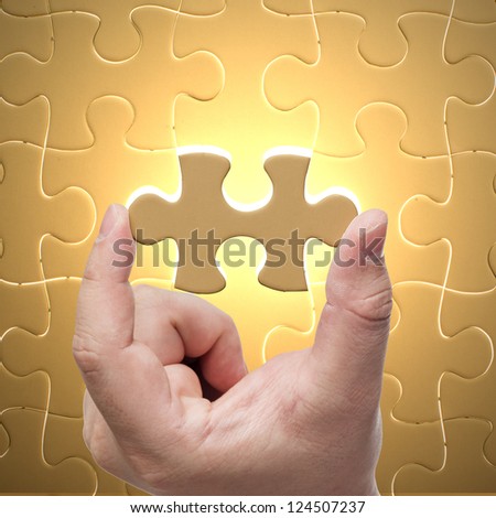 Missing jigsaw puzzle piece with light glow, business concept for completing the final puzzle piece