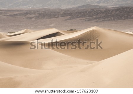 Desert Sand Dunes with mountain in the background