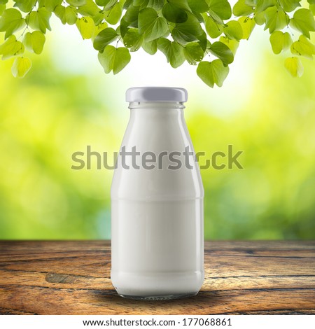 Bottle of milk on wood table