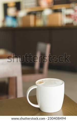 Cup of Coffee on Table inside Coffee Shop