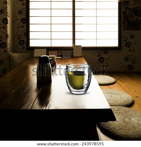 Glass of Green Tea on wood table in Japanese Tea House Style