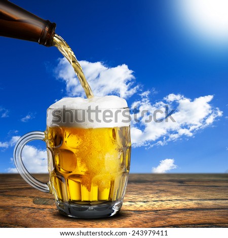 Beer Pour into Glass on Wood Table