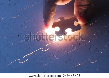 Missing jigsaw puzzle piece with light glow, business concept for completing the final puzzle piece