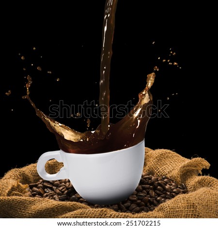 Coffee Splash From Cup on Coffee Beans