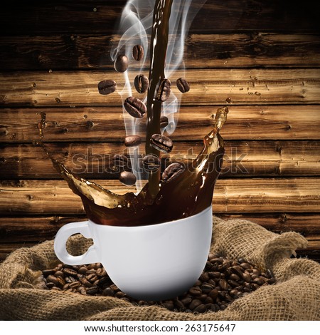 Coffee Beans Falling Into Glass of Hot Coffee Splash on Wooden Background