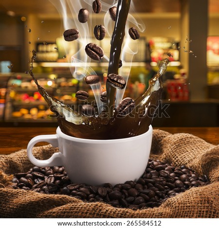 Coffee Splash from Cup With Coffee Beans. Coffee Shop in Background