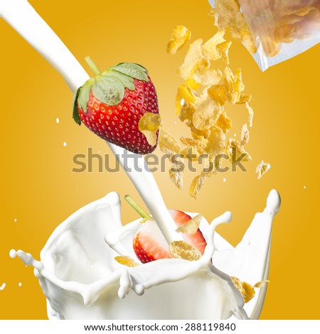 Corn Flakes With Strawberry Falling into Milk Splash