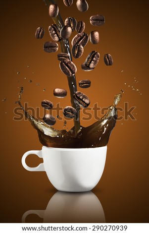 Coffee Beans Falling Into Glass of Hot Coffee Splash