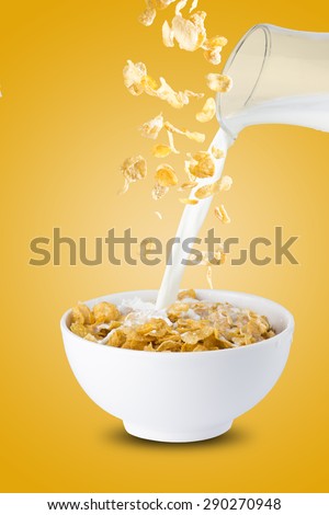 Milk Pour Into Bowl of Cereal Corn Flakes