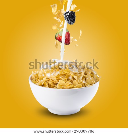 Corn Flakes With Strawberry and Blackberry Falling into A Bowl of Milk Splash