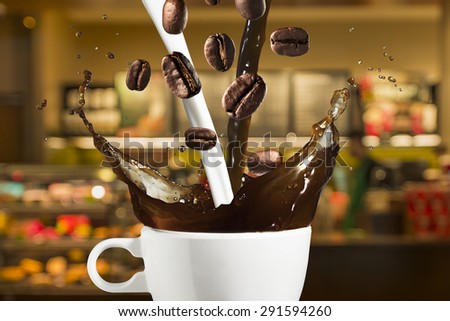 Coffee and Milk Splash from Cup With Coffee Beans Falling. Coffee Shop in Background