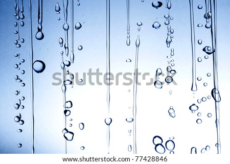 Flow of water and water drop on blue and white background