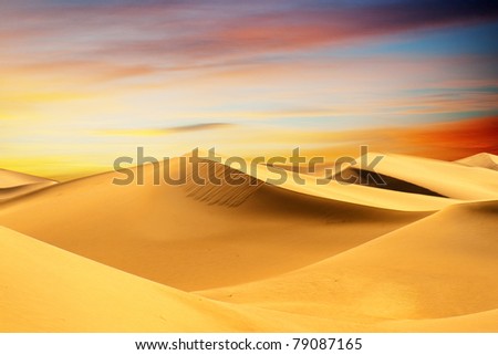 Sandy desert at sunset time