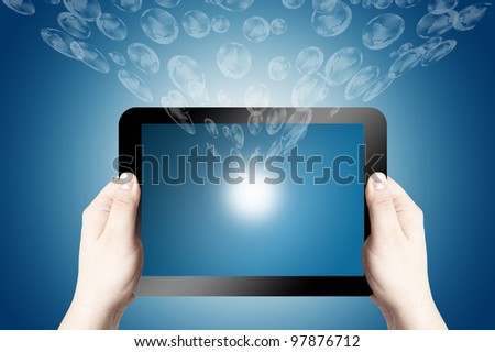Two Hands holding on digital tablet with 3D globe icon coming from the screen on blue background