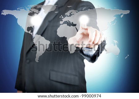 Business man pointing on the touch screen with world map. Concept for connectivity