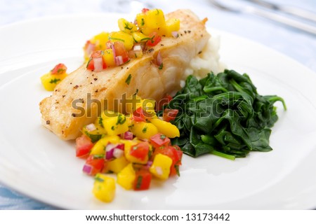 Sea bass with mango salsa, mashed potato and spinach
