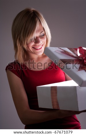 Girl opens gift box