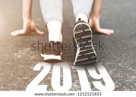 beautiful girl in sports uniform running around. Healthy way of life, an infused figure. sneakers close-up, finish 2018. Start to new year 2019, plans, goals, objectives