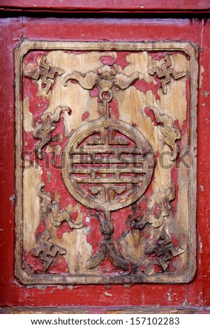 Ancient wooden chinese mural with flaking paint