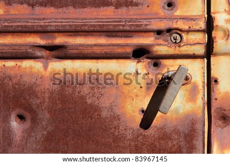 Rusty door of an old pickup truck