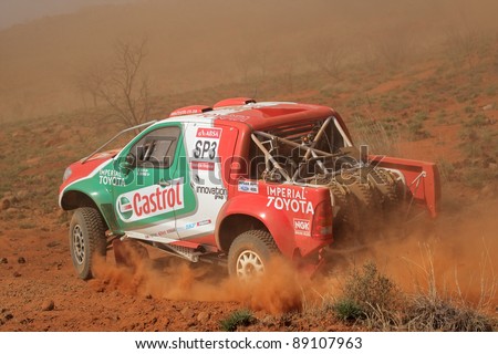 BLOEMFONTEIN, SOUTH AFRICA - OCTOBER 15: Duncan Vos and Rob Howie in their Toyota Hilux in action during a South African off road championship event in Bloemfontein, South Africa on October 15, 2011
