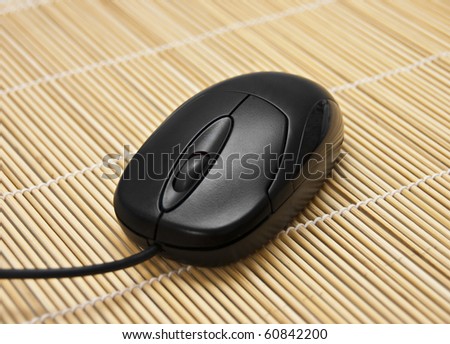 Black mouse on a mat