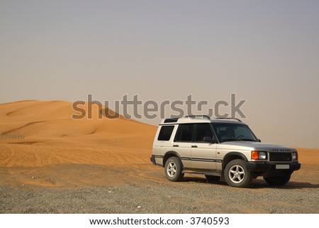 stock photo Off Road Land Rover Discovery by Sand Dunes