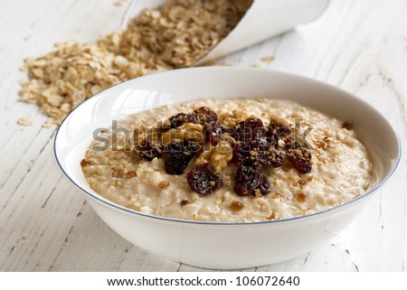 Porridge with walnuts, raisins and brown sugar.  Delicious oatmeal.