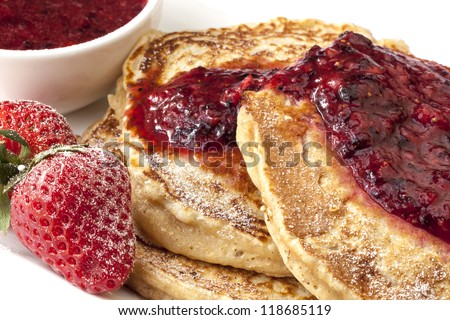 Buckwheat pancakes topped with a mixed berry coulis.  Healthy, low-fat, low-GI eating.