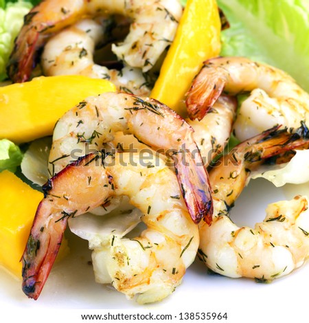 Shrimp and mango salad, garnished with dill.  Delicious, healthy eating.