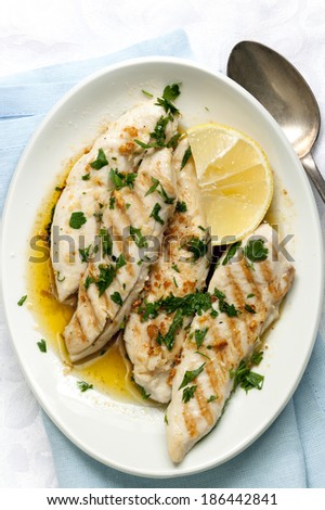 Chicken with garlic and lemon.  Overhead view.