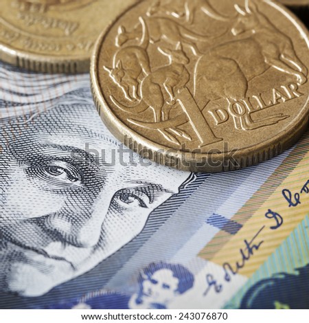 Australian money.  One dollar coin with kangaroos, over face of Edith Cowan.