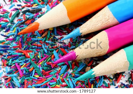 Keep it Sharp!  Macro of four bright-colored pencils on pencil shavings