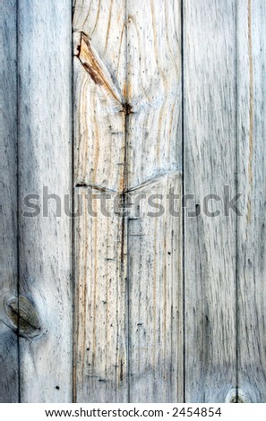 Weathered natural timber planks, faded to blue-gray.  Shows grain and knots.