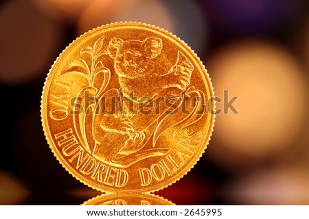 A gold Australian $200 coin, with a colorful light background.  Commemorative, uncirculated coin.