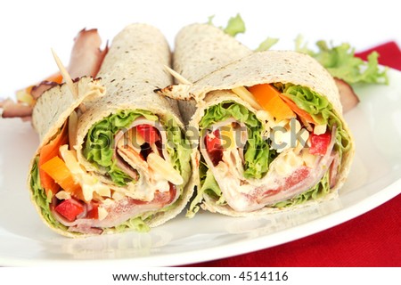 Ham wrap sandwich with salad and mayonnaise.