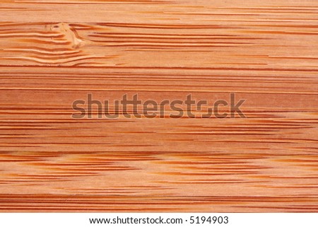 Timber texture forms a full-frame background.  Macro of bamboo board.