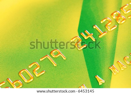 Macro of green and gold bank card.